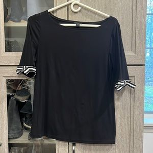 Black t-shirt with back and white ribbon/bows on sleeves
